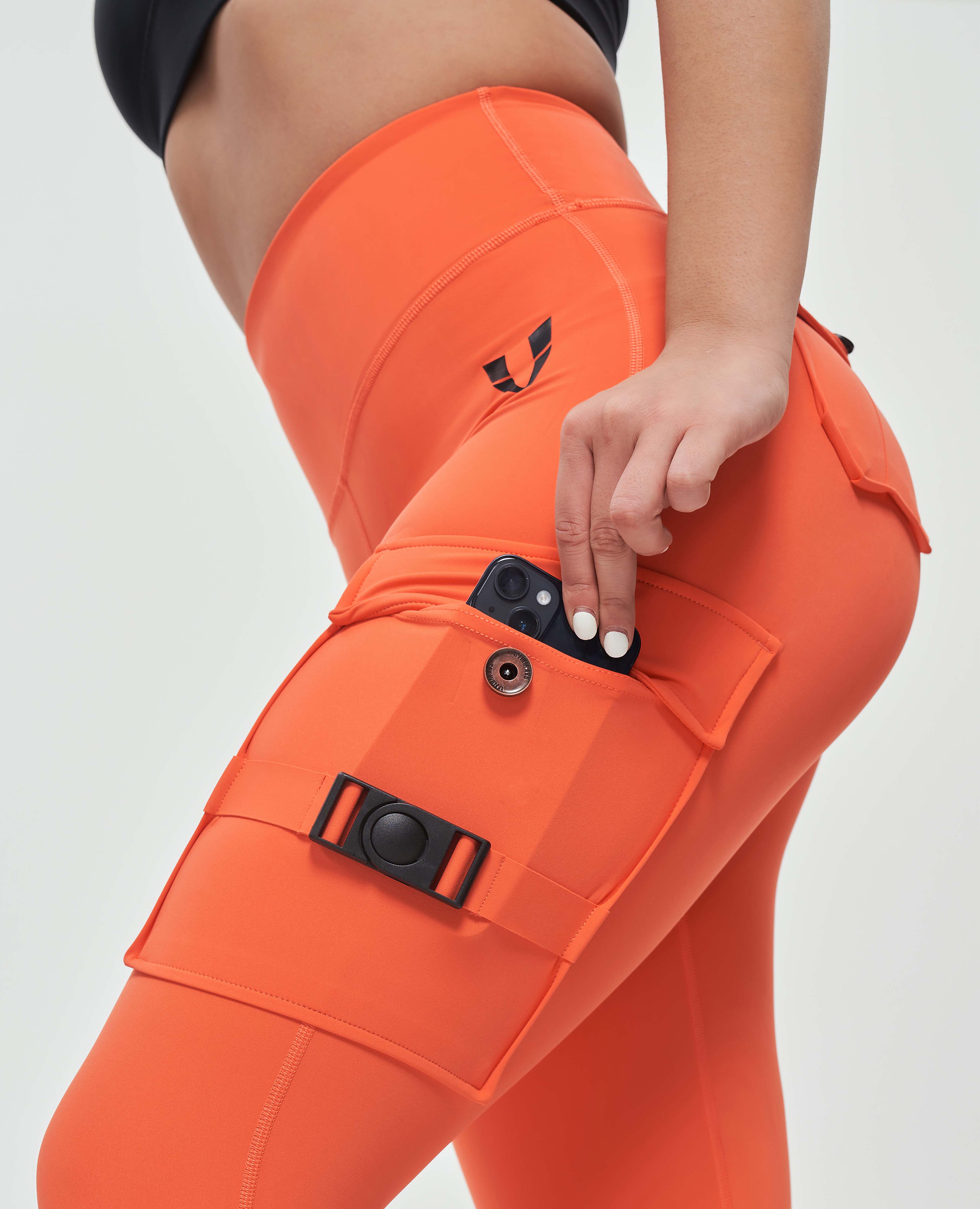FIRM ABS orange durable leggings for outdoor activities with multiple secure pockets and high waist design