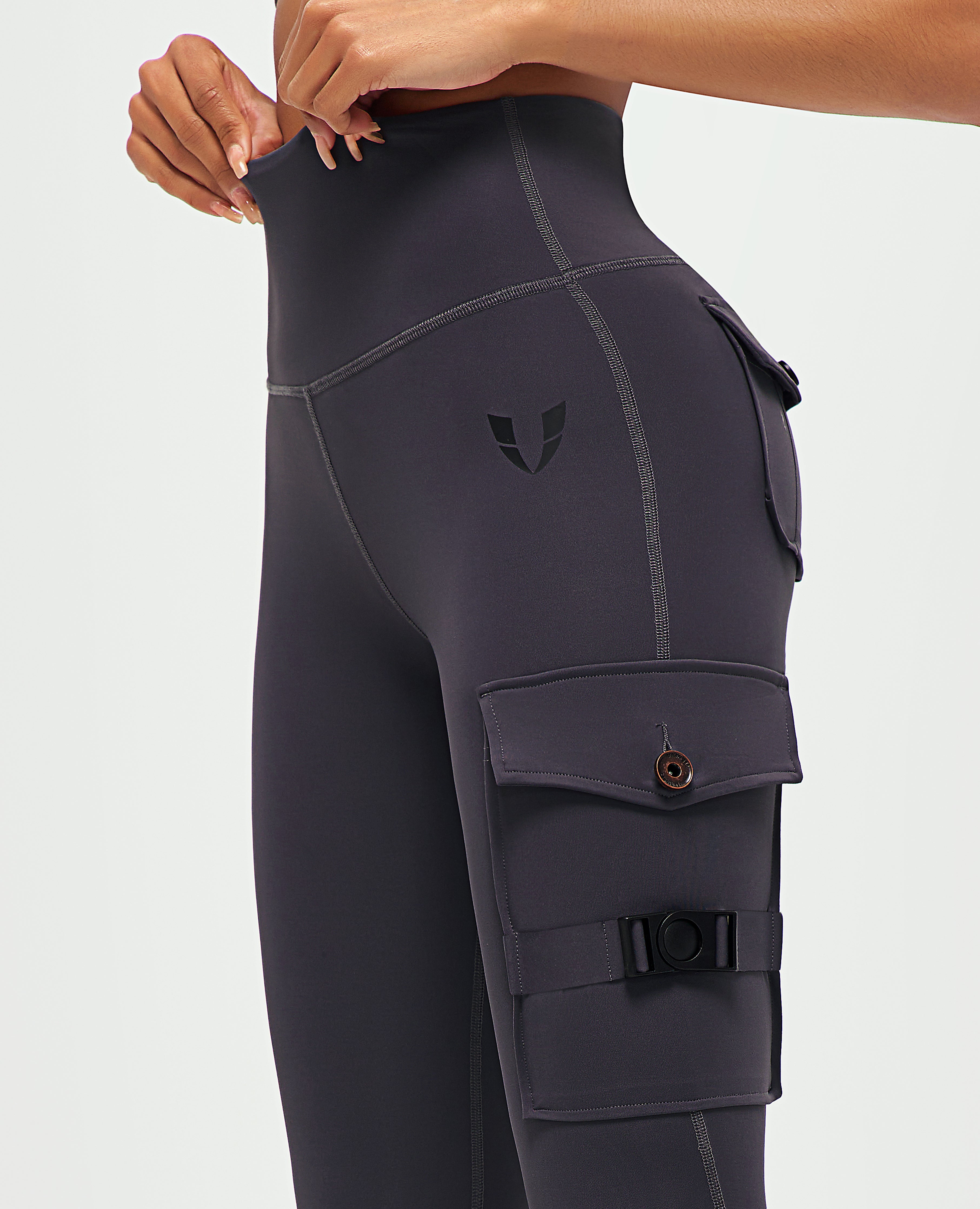 FIRM ABS women's fitness leggings with pockets in dark gray featuring high waist and cargo style side pockets