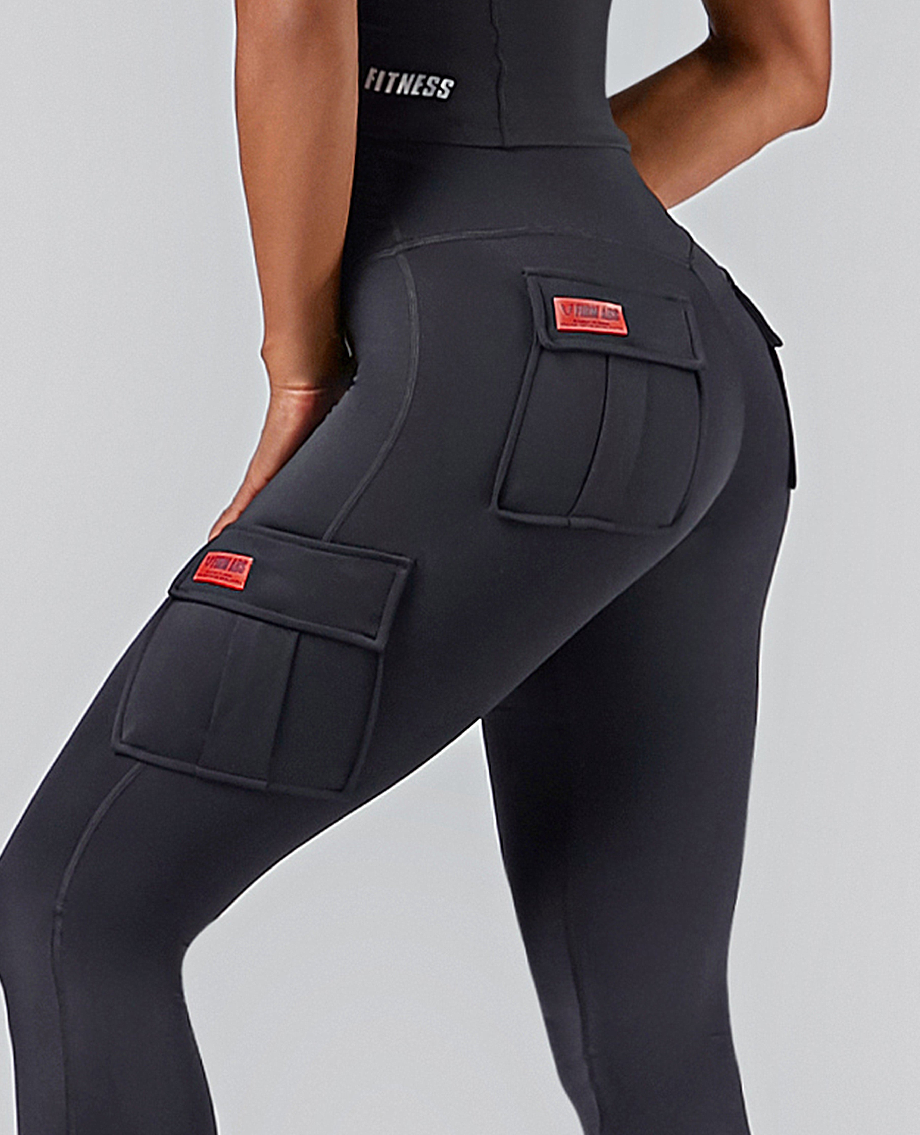 FIRM ABS high-waisted cargo leggings in black with multiple pockets and red logo patches