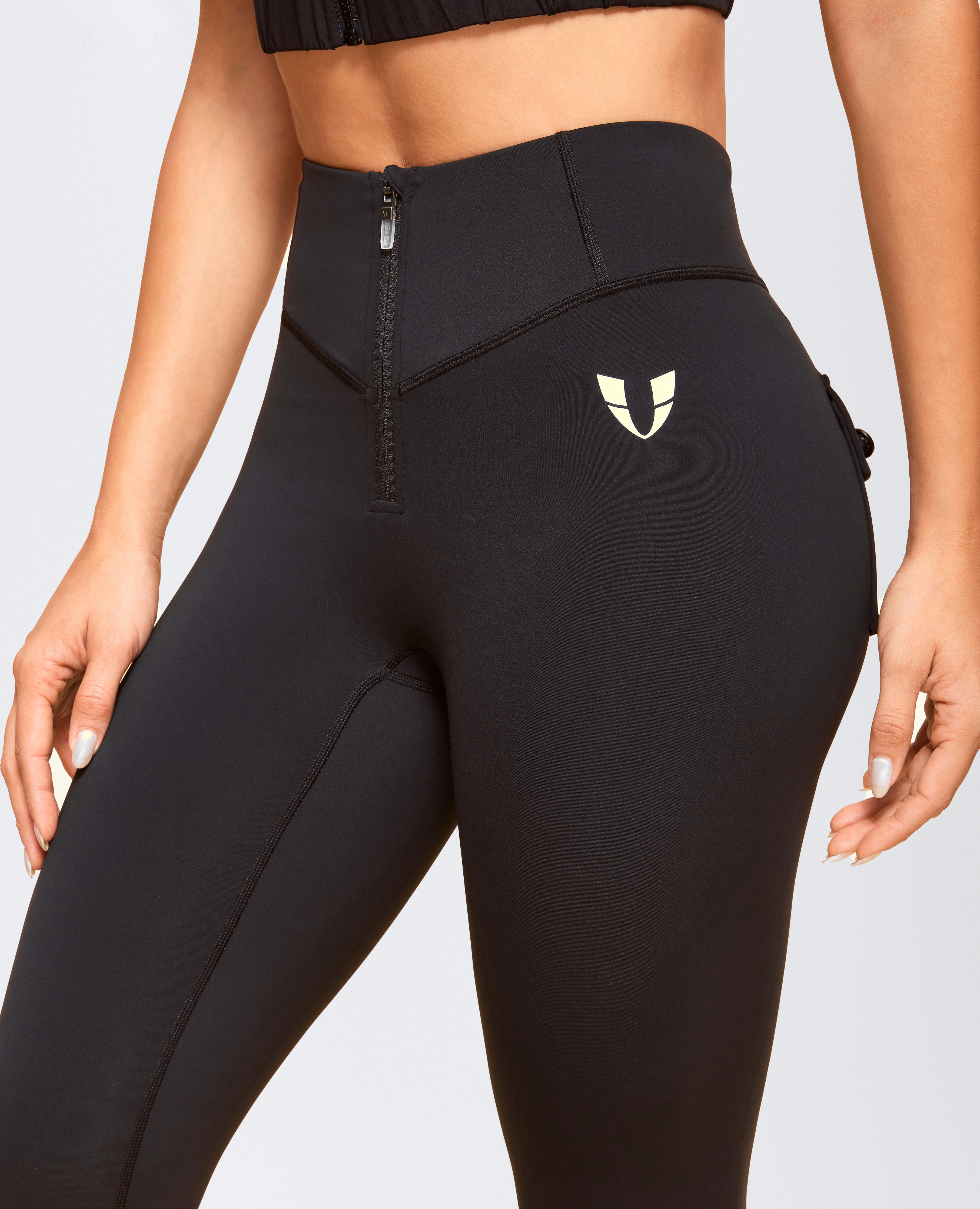 Pocchi anteriore con zip potenti leggings - nero