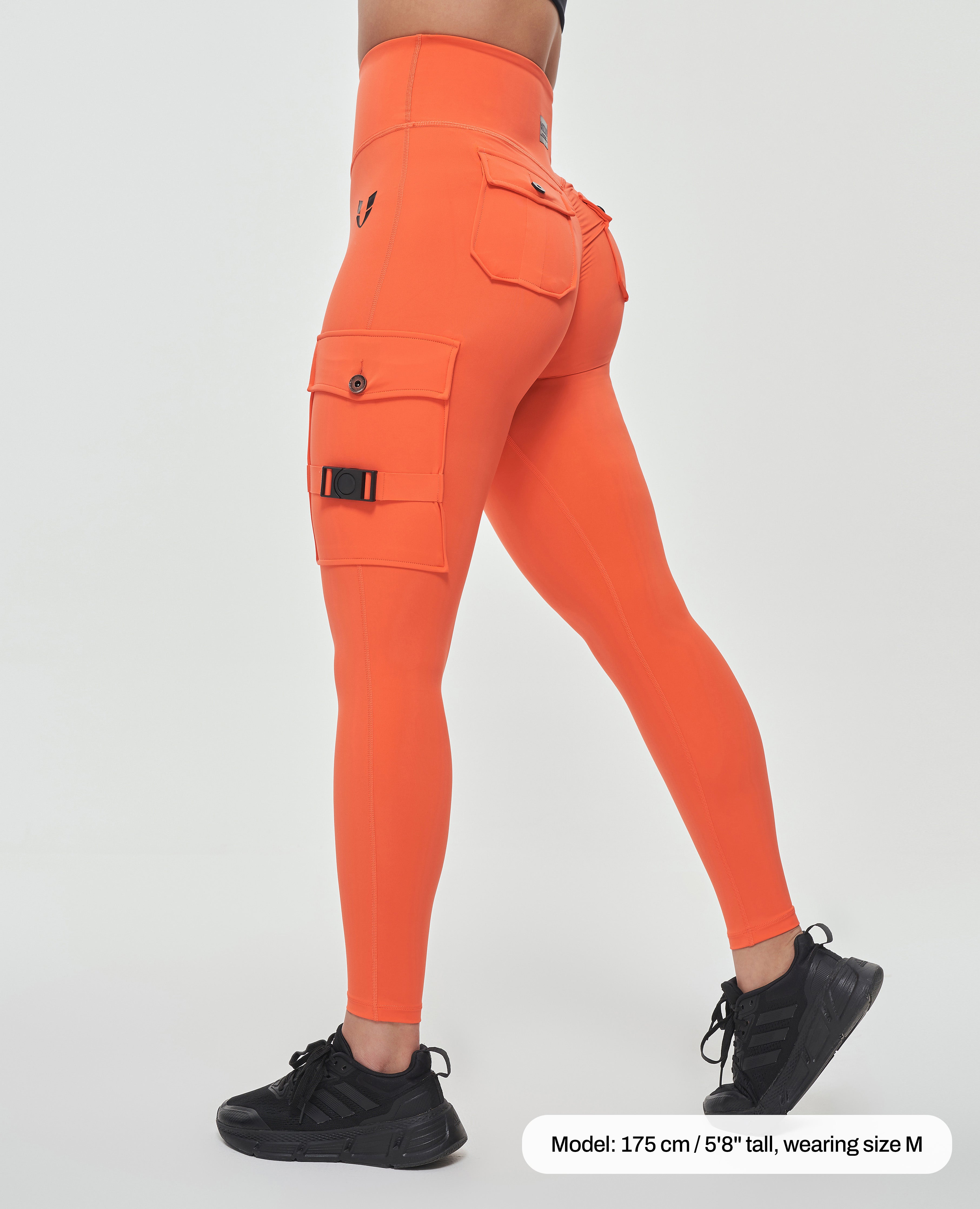 Bright orange durable leggings for outdoor activities with side pockets and high waist from FIRM ABS