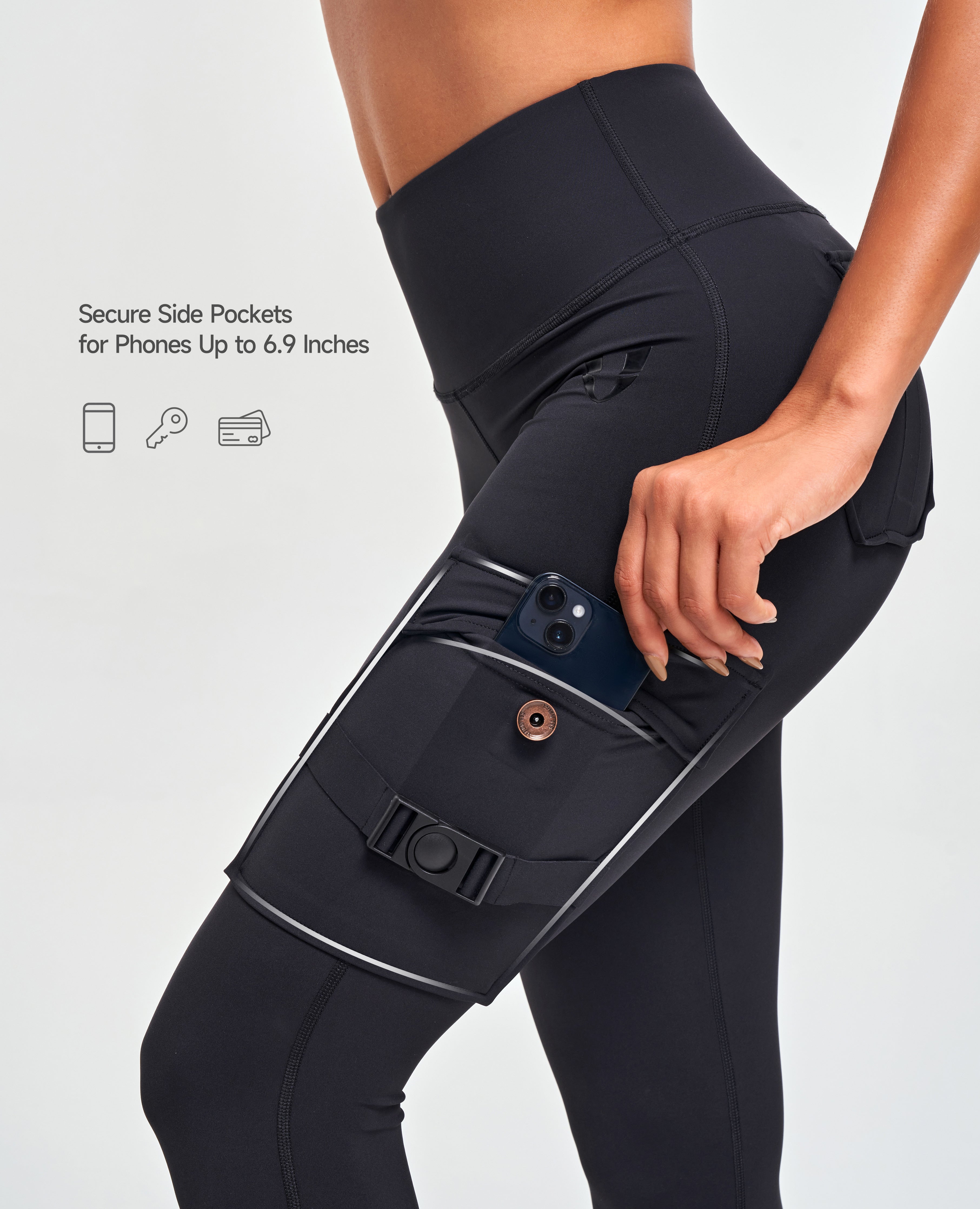 FIRM ABS high-waisted cargo leggings in black with secure side pocket holding a phone up to 6.9 inches